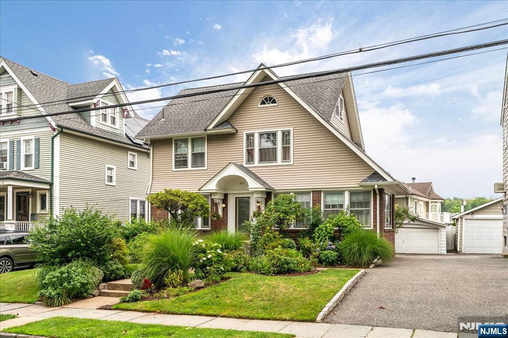 217 Mountain Way Rutherford, NJ 07070 - Photo 2 of 28 a front view of a house with a yard