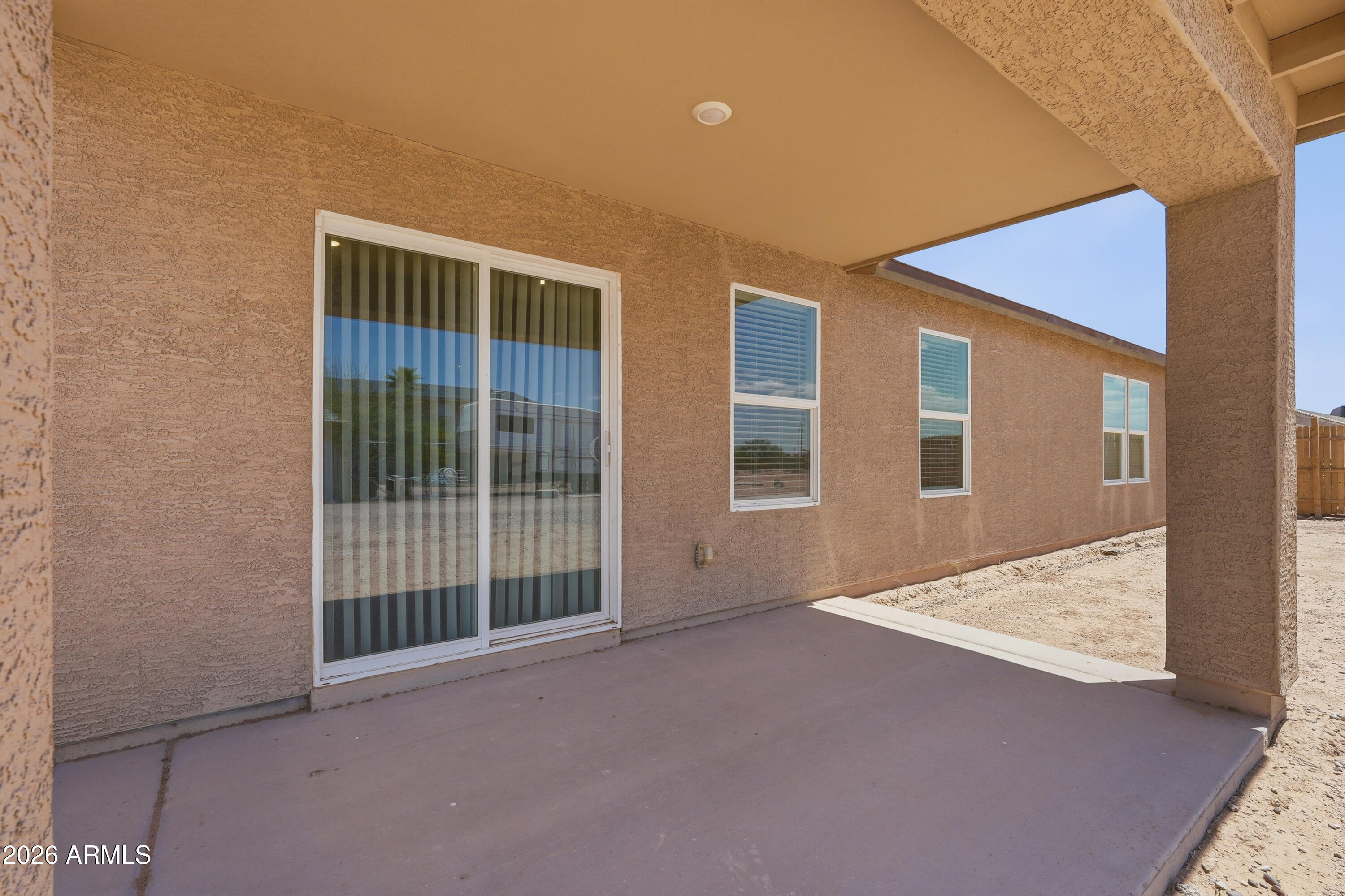 15610 South Moon Valley Road Arizona City, AZ 85123 - Photo 32 of 36 a view of an empty room with windows