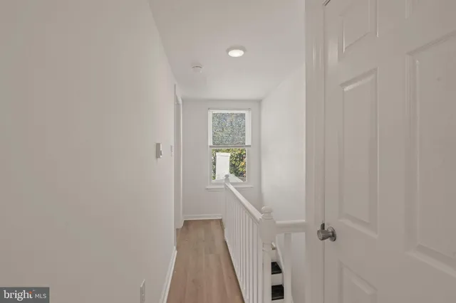 a view of a hallway with a white walls