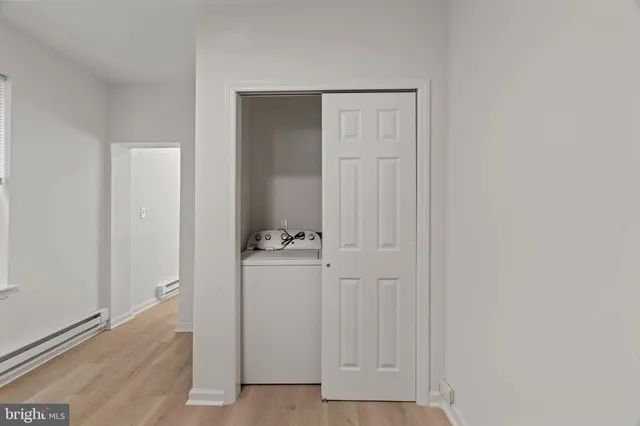 an empty room with closet area