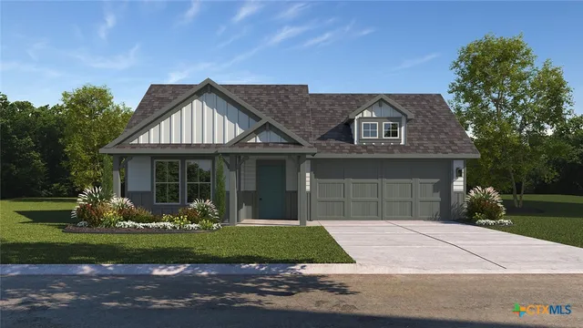 a front view of a house with a garden and plants