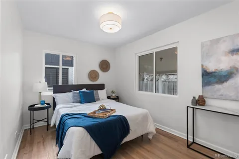 a bedroom with bed and a window