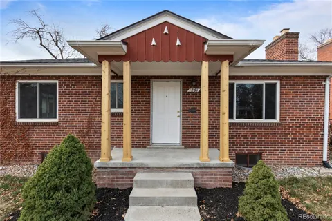 a front view of a house with large windows