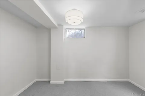 a view of a decorative light in a empty room
