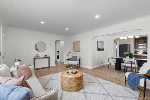 a living room with furniture and a table