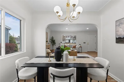 a view of a dining room with a table and chairs