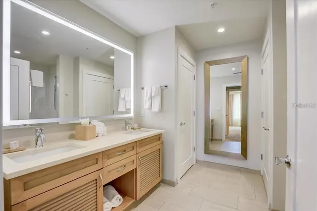 a spacious bathroom with a double vanity sink mirror and double