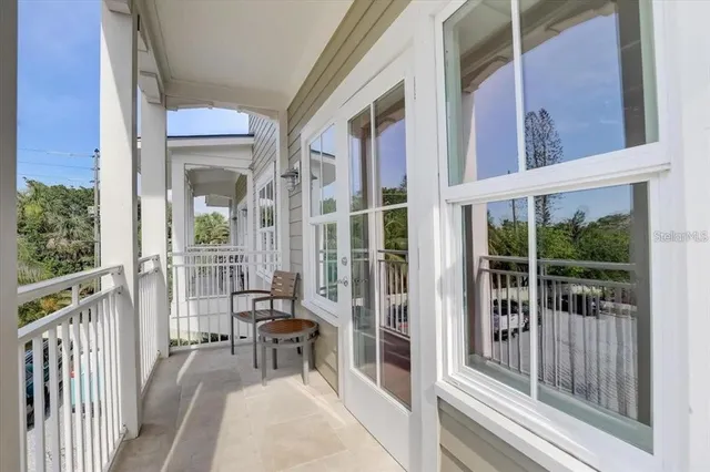 an open kitchen with dining table and wooden floors
