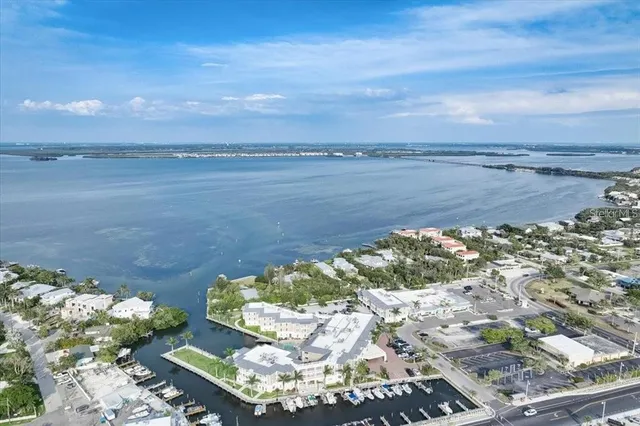 an aerial view of a houses and a yard