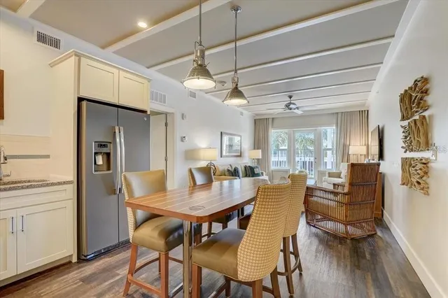 a dining room with furniture and wooden floor