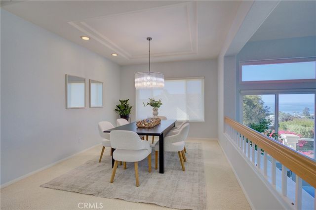 a bathroom with a granite countertop bathtub sink vanity mirror and toilet