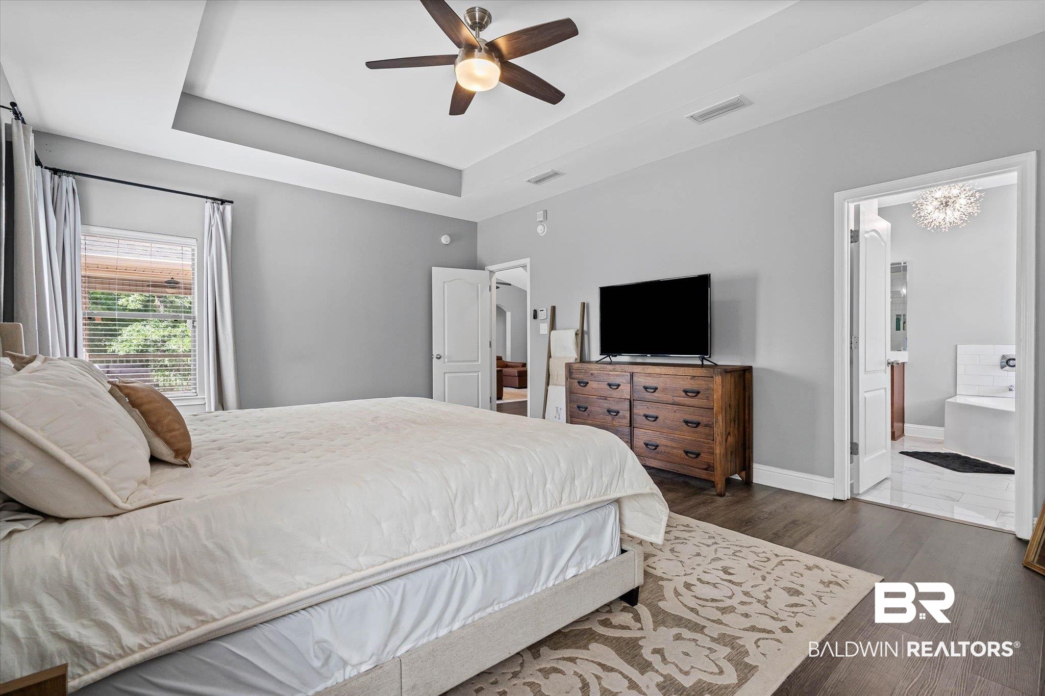 3739 Whitestone Drive Semmes, AL 36575 - Photo 13 of 25 Bedroom featuring wood-finish flooring, a tray ceiling with a ceiling fan, and a window with blinds