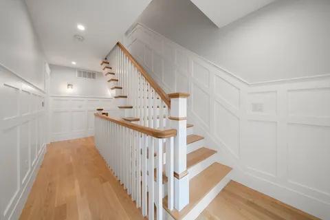 a view of a hallway with staircase