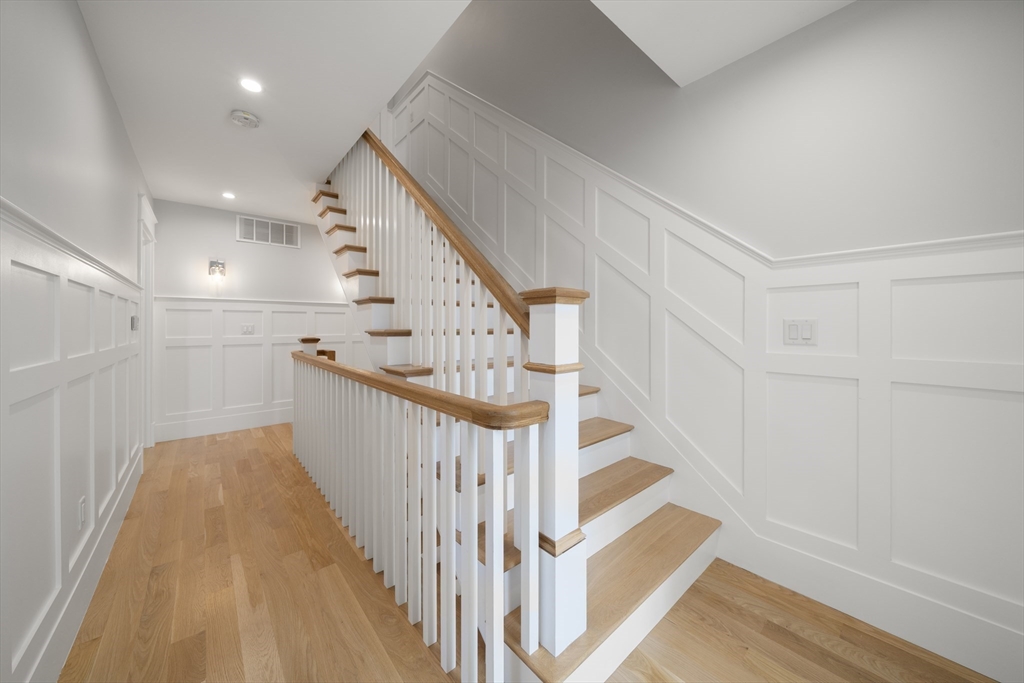 74-76 Butler Road Quincy, MA 02169 - Photo 15 of 41 a view of a hallway with staircase
