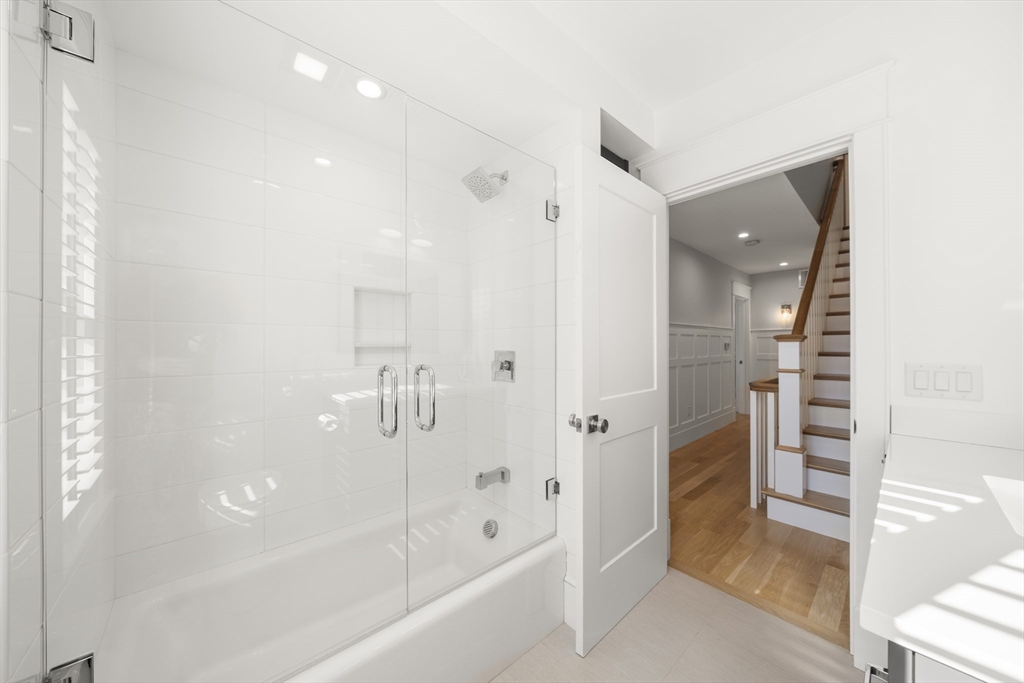 74-76 Butler Road Quincy, MA 02169 - Photo 22 of 41 a bathroom with a bathtub and a shower