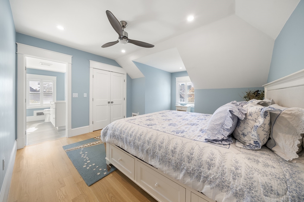 74-76 Butler Road Quincy, MA 02169 - Photo 23 of 41 a bedroom with a large bed and a chandelier