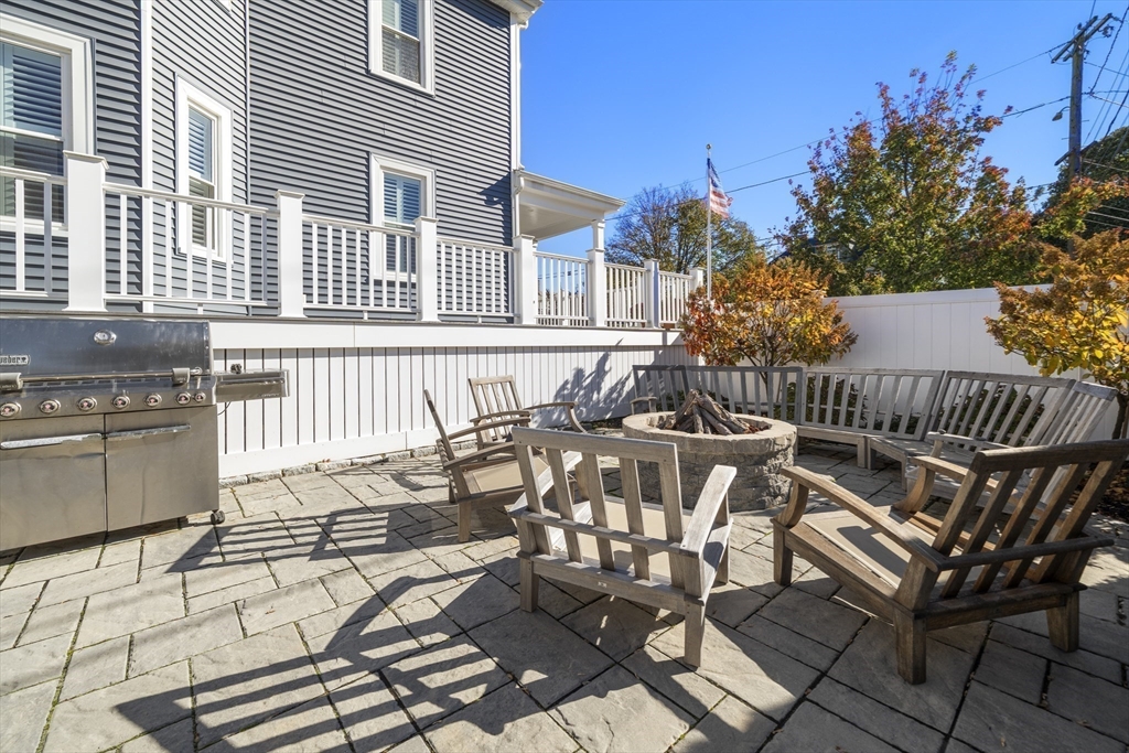 74-76 Butler Road Quincy, MA 02169 - Photo 36 of 41 a view of a chairs and table on the terrace