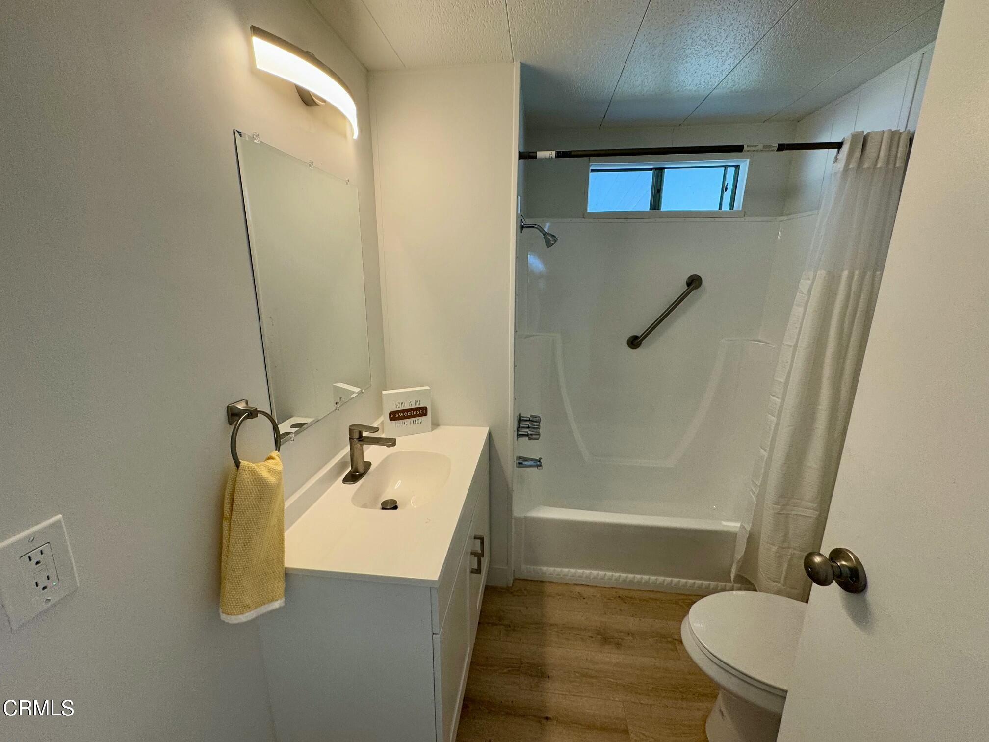 285 Ibsen Place, Unit 10 Oxnard, CA 93033 - Photo 15 of 32 a bathroom with a sink a toilet and shower