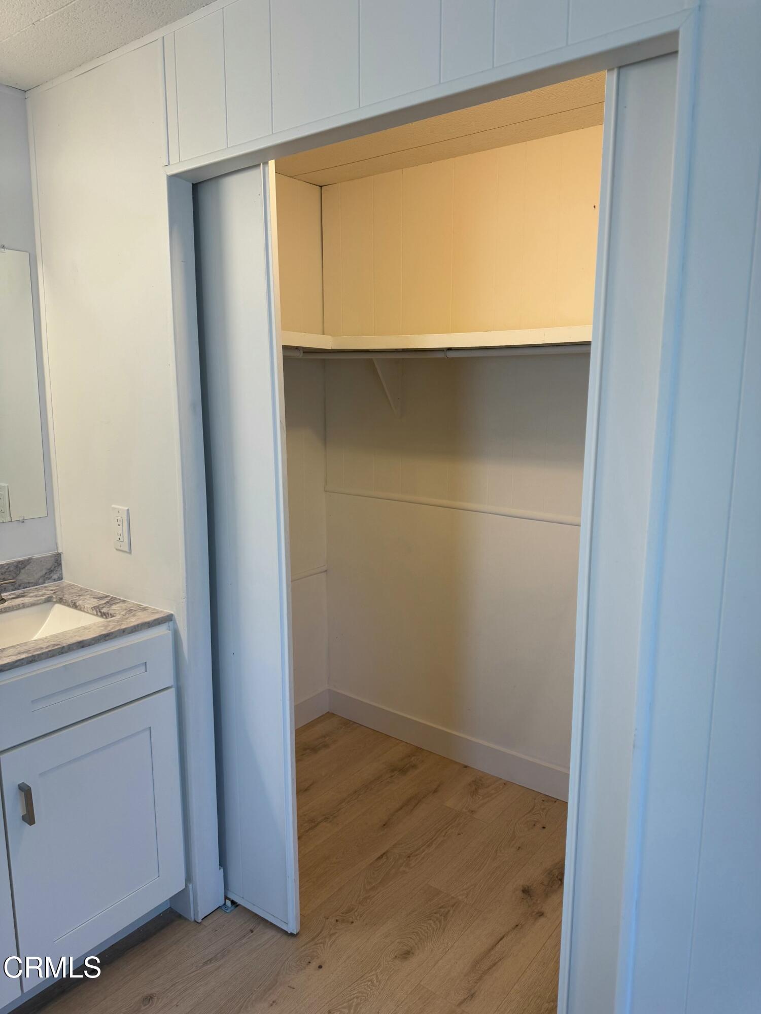 285 Ibsen Place, Unit 10 Oxnard, CA 93033 - Photo 27 of 32 a bathroom with a sink and a mirror