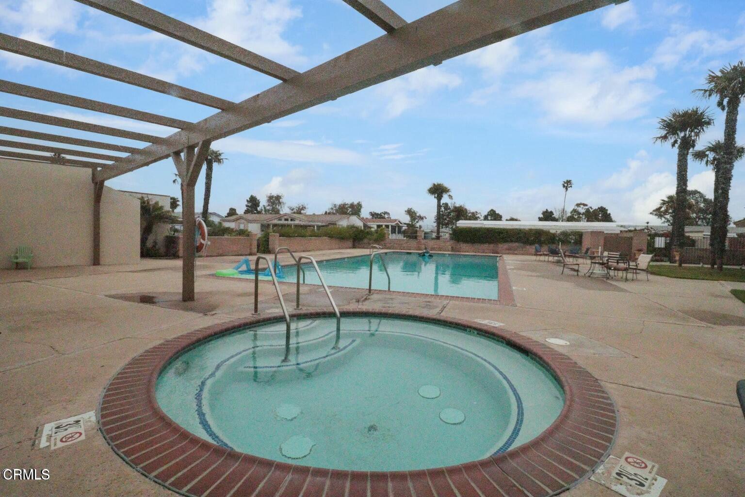 285 Ibsen Place, Unit 10 Oxnard, CA 93033 - Photo 32 of 32 a view of a swimming pool with a patio