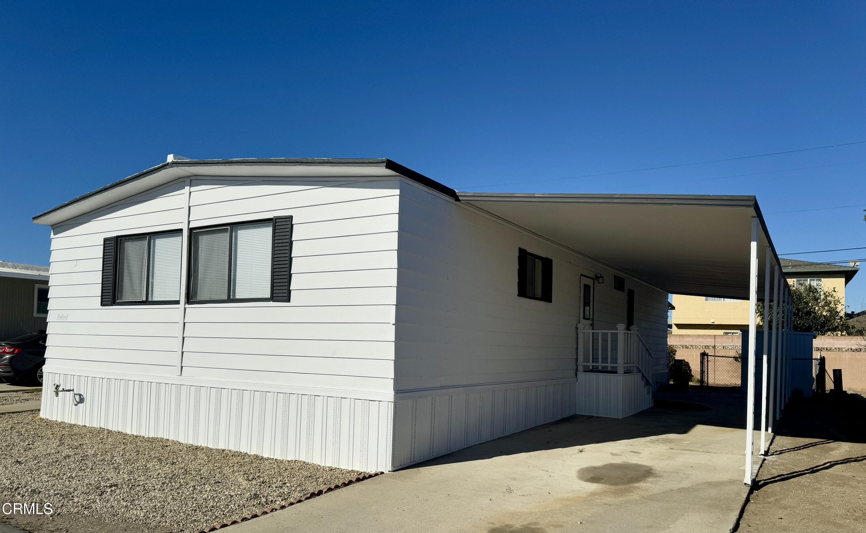 285 Ibsen Place, Unit 10 Oxnard, CA 93033 - Photo 4 of 32 a view of a house with a backyard