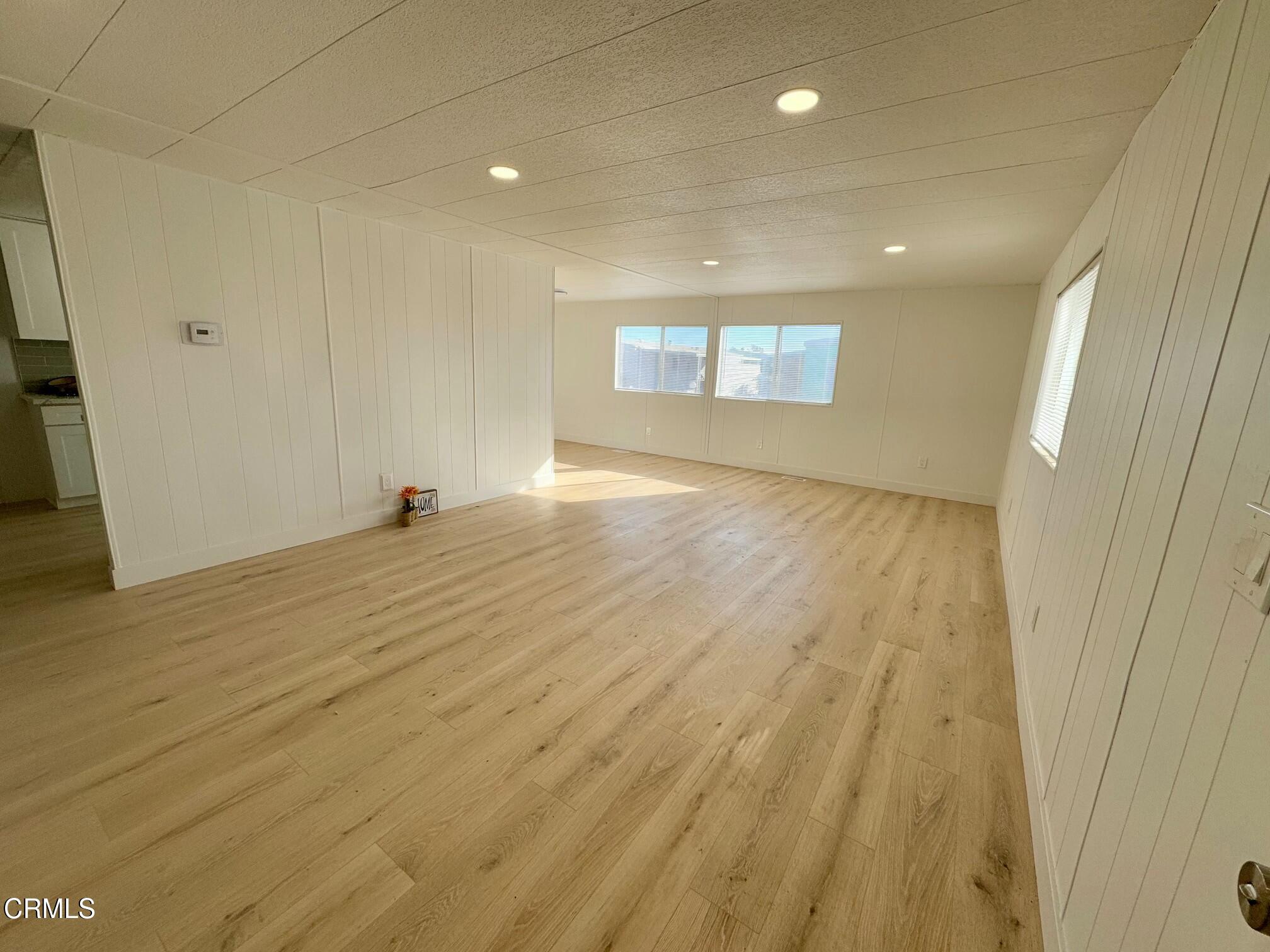 285 Ibsen Place, Unit 10 Oxnard, CA 93033 - Photo 6 of 32 a view of a livingroom with wooden floor