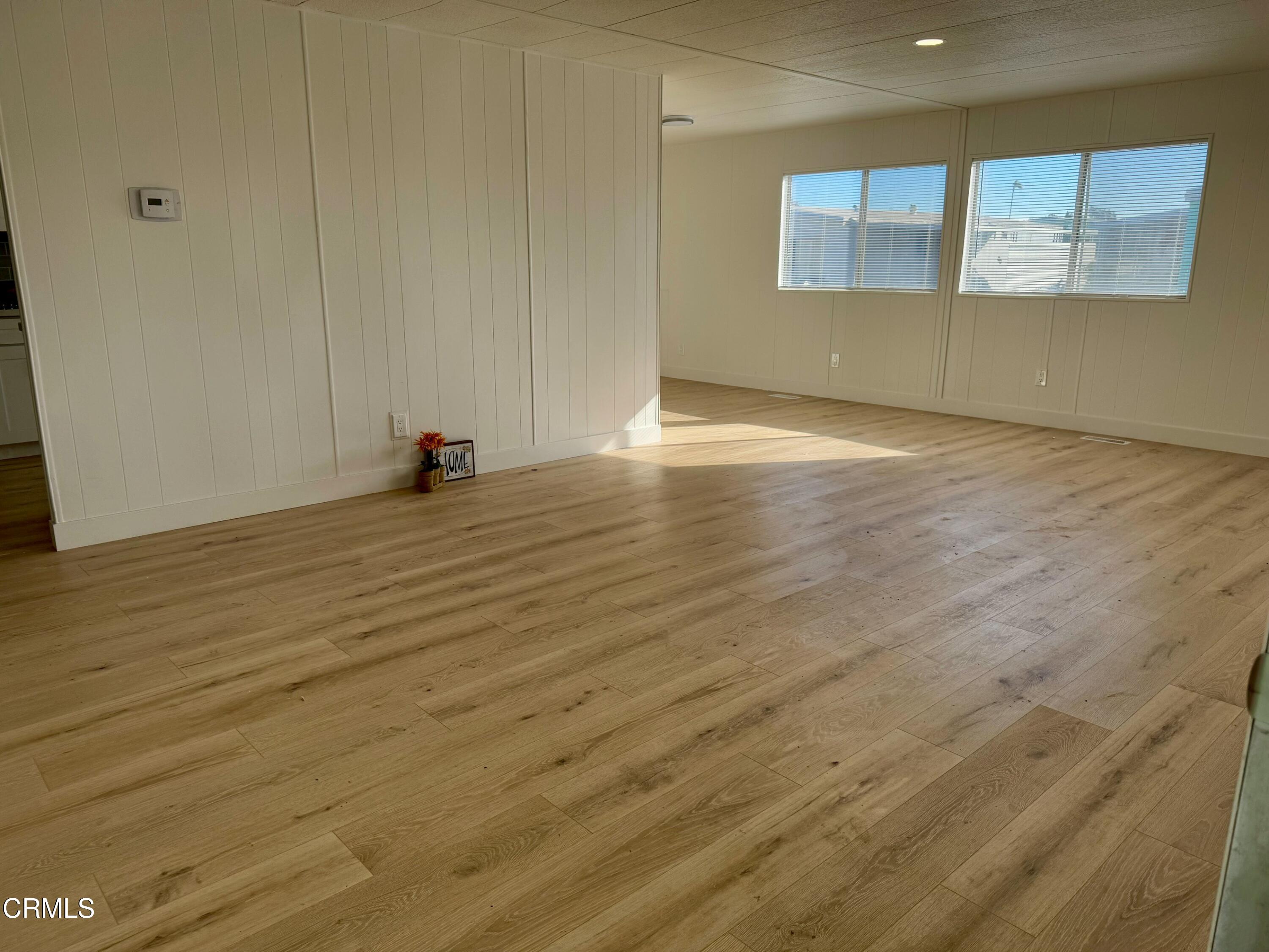 285 Ibsen Place, Unit 10 Oxnard, CA 93033 - Photo 7 of 32 a view of a room with wooden floor