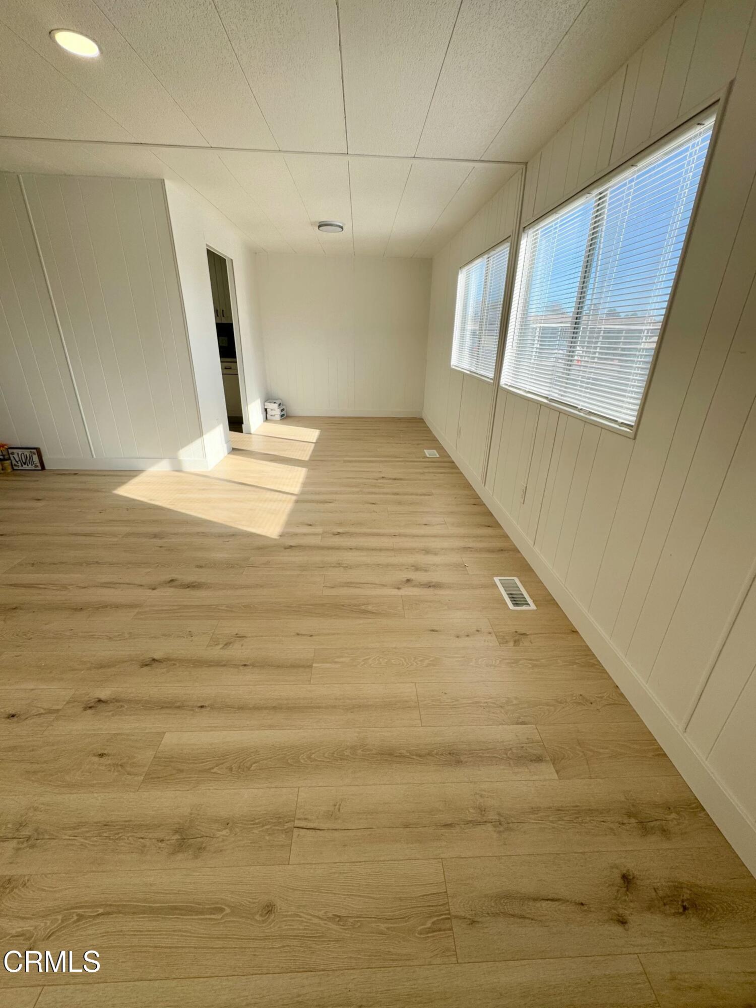 285 Ibsen Place, Unit 10 Oxnard, CA 93033 - Photo 8 of 32 a view of a room with wooden floor