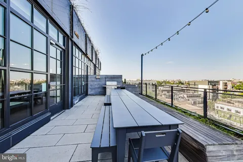a view of balcony with furniture