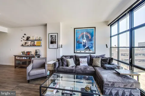 a living room with furniture and a window