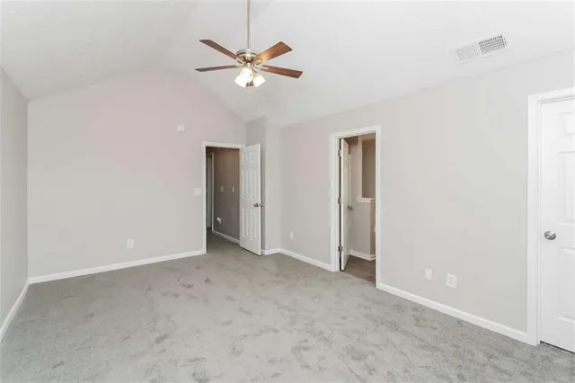 an empty room with fan