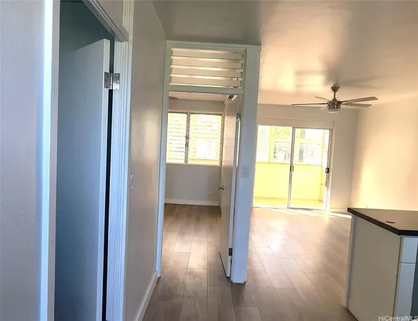 a view of an empty room and a window