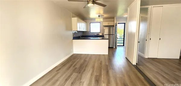 a view of a kitchen from the hallway