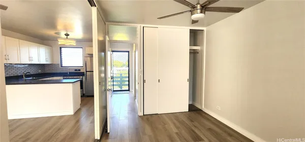 a view of hallway with wooden floor