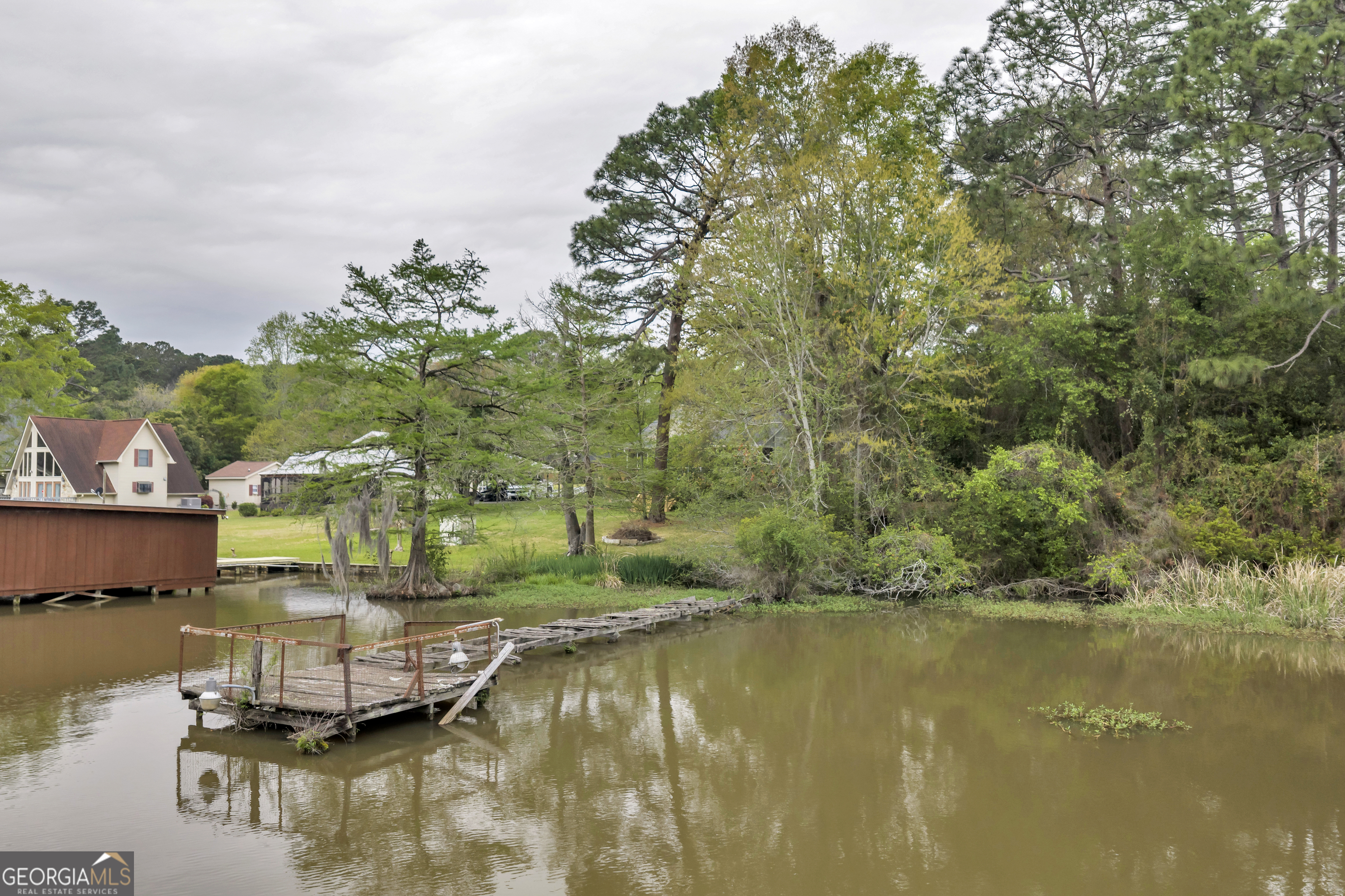 728 Cork Ferry Road Cordele, GA 31015 - Photo 7 of 12 a view of a lake with houses