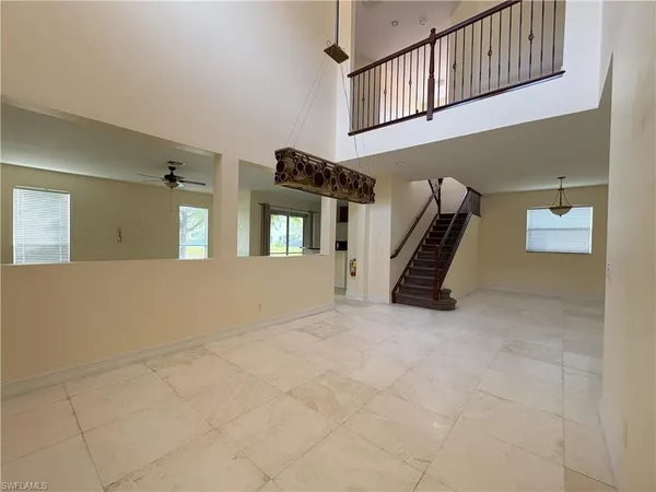 a view of an empty room with windows