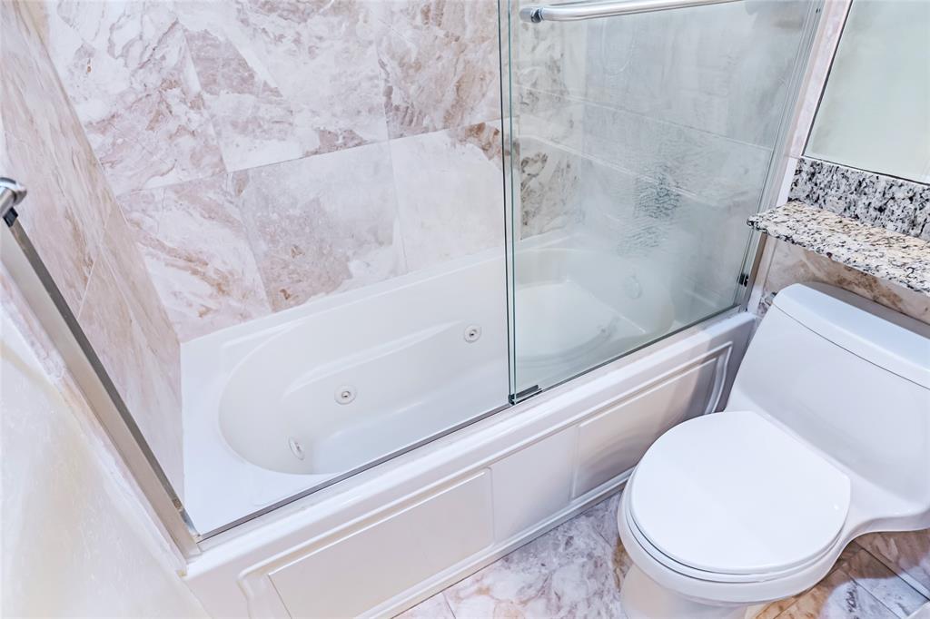 2900 Northeast 30th Street, Unit 3F Fort Lauderdale, FL 33306 - Photo 16 of 30 a bathroom with a toilet and a shower