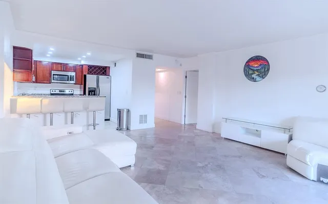 a spacious bathroom with a sink a mirror and a bathtub