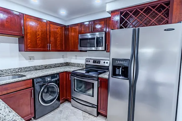 a kitchen with a stove and a microwave