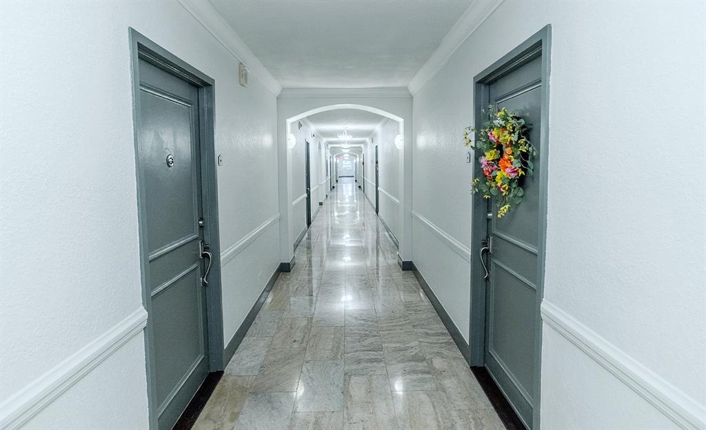 2900 Northeast 30th Street, Unit 3F Fort Lauderdale, FL 33306 - Photo 30 of 30 a view of a hallway with wooden floor and stairs