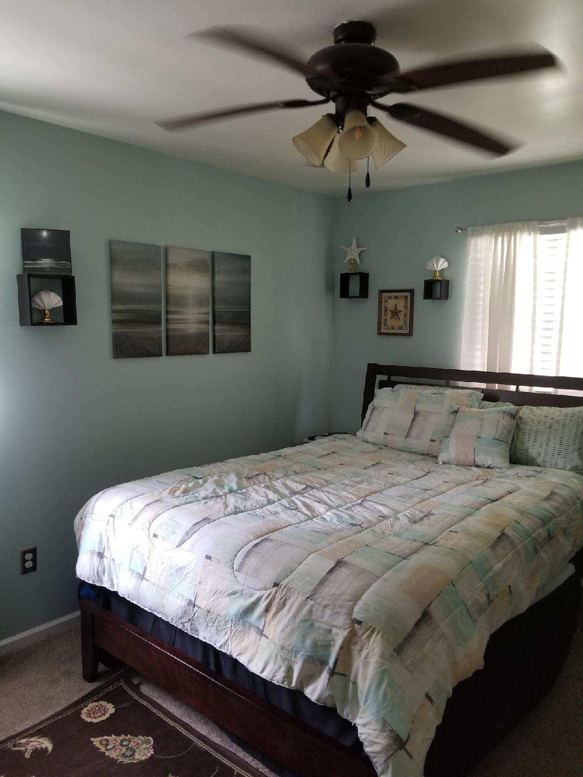 5423 Twilight Road Roanoke, VA 24019 - Photo 12 of 23 a bedroom with a bed and a chandelier