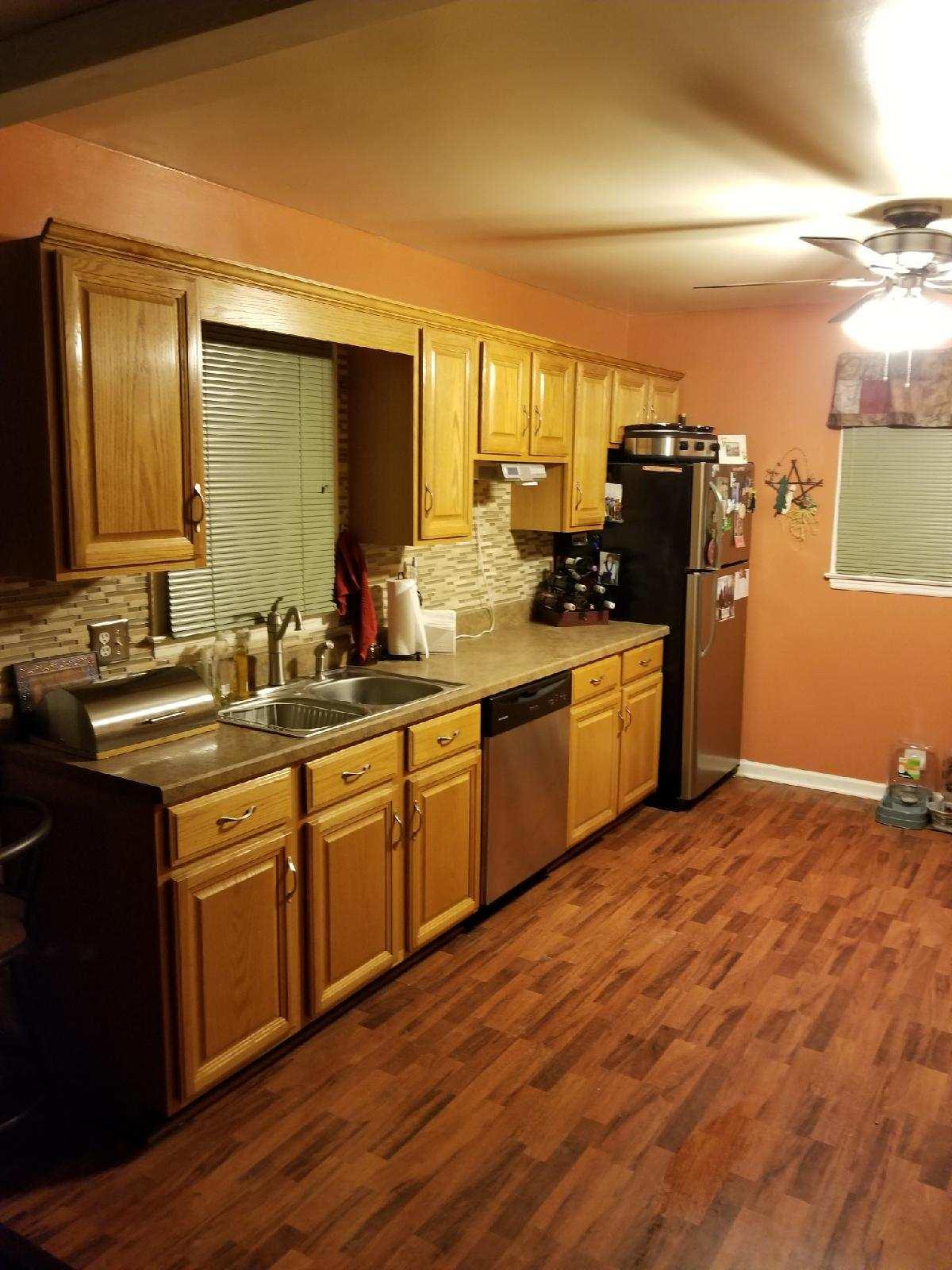 5423 Twilight Road Roanoke, VA 24019 - Photo 6 of 23 a kitchen with stainless steel appliances granite countertop a sink stove and refrigerator