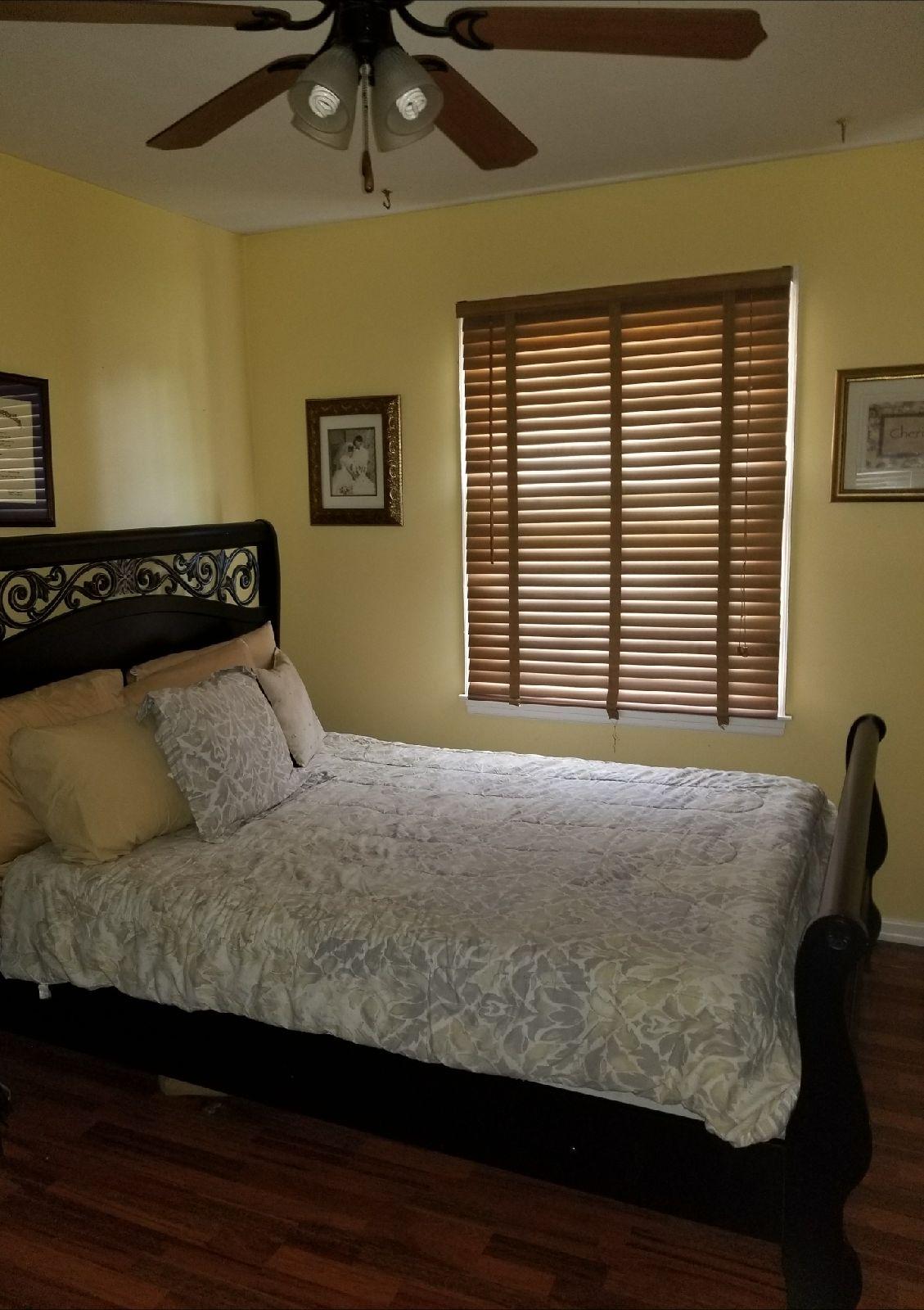 5423 Twilight Road Roanoke, VA 24019 - Photo 9 of 23 a bed sitting in a bedroom next to a window