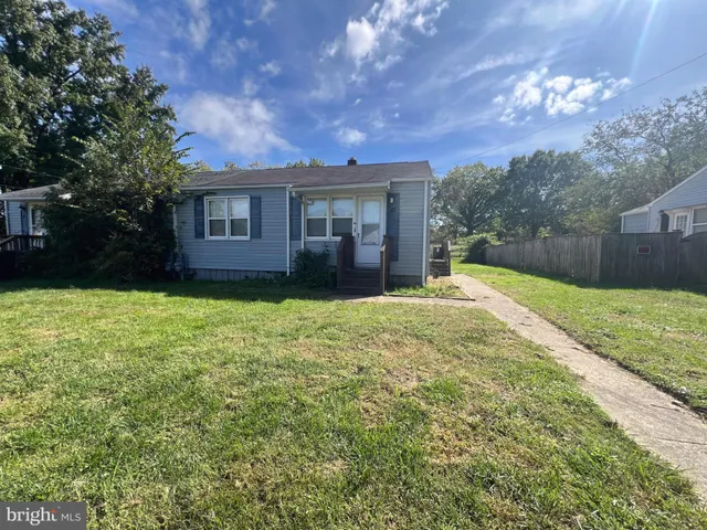 a house view with a sitting space and garden