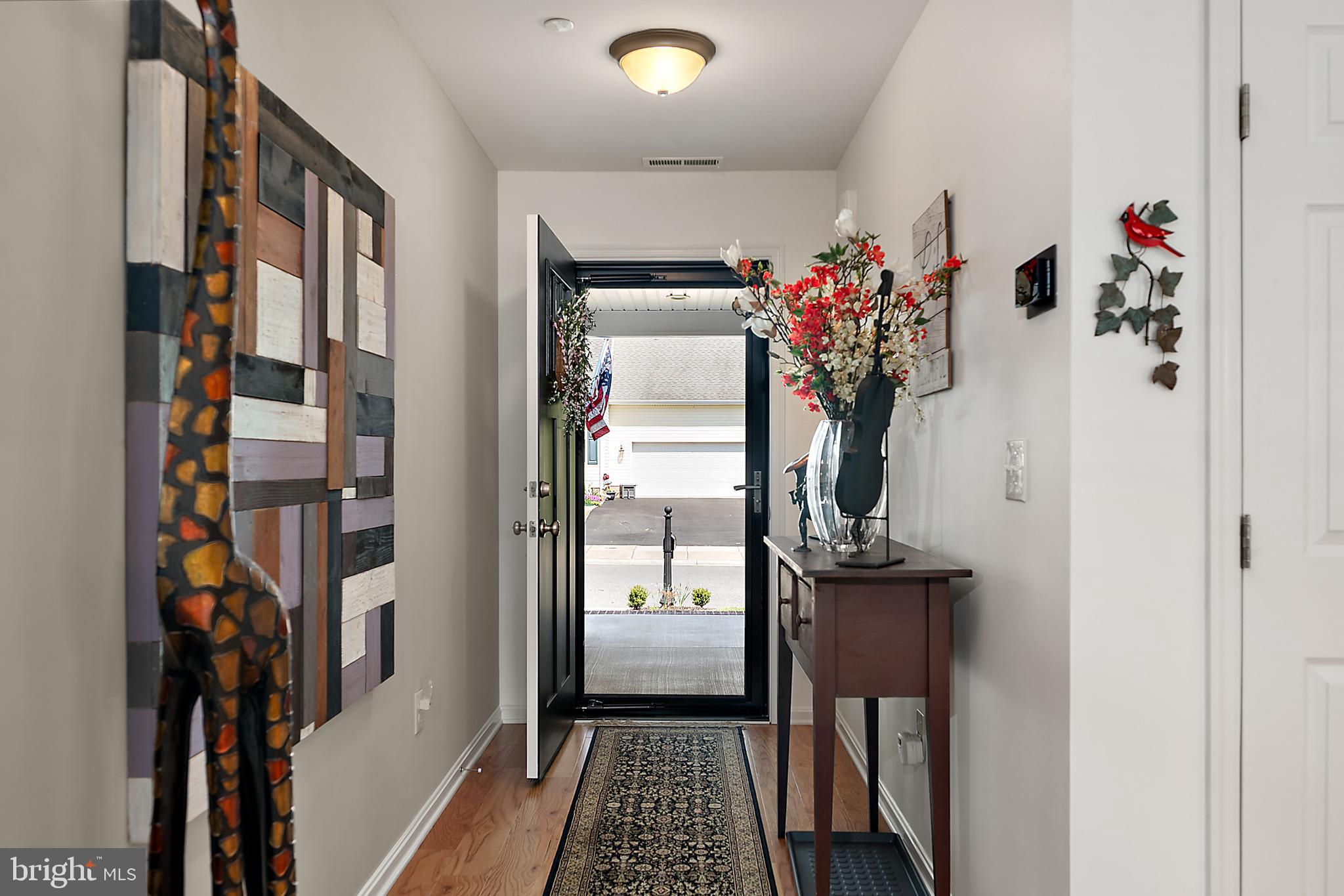 6098 Tarry Town Road Salisbury, MD 21801 - Photo 11 of 60 a view of a hallway with paintings on the wall