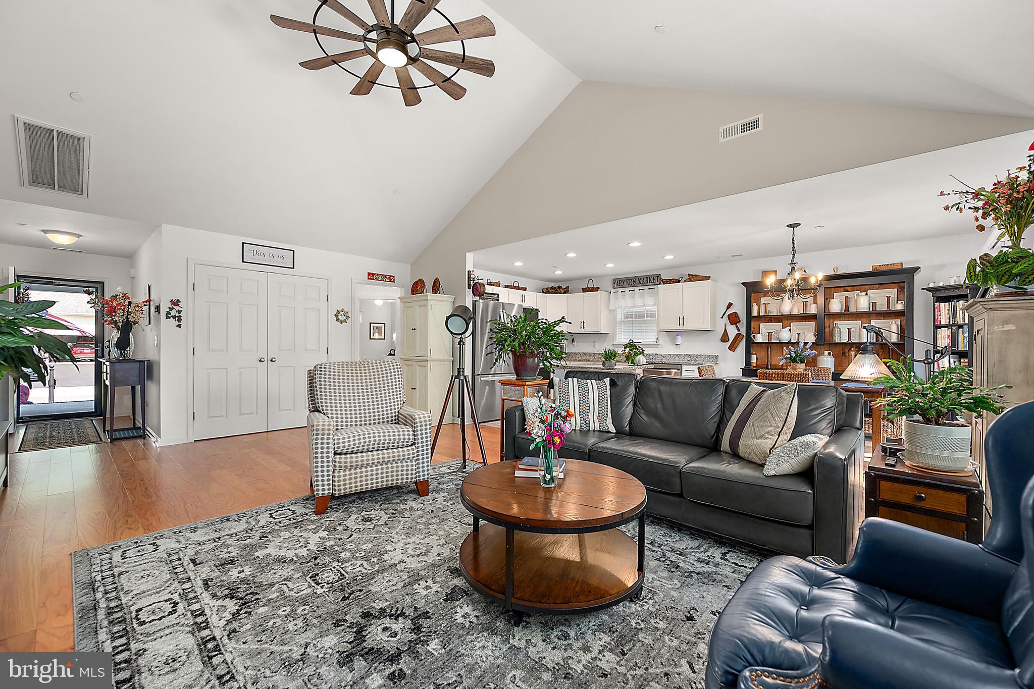 6098 Tarry Town Road Salisbury, MD 21801 - Photo 12 of 60 a living room with furniture and a chandelier