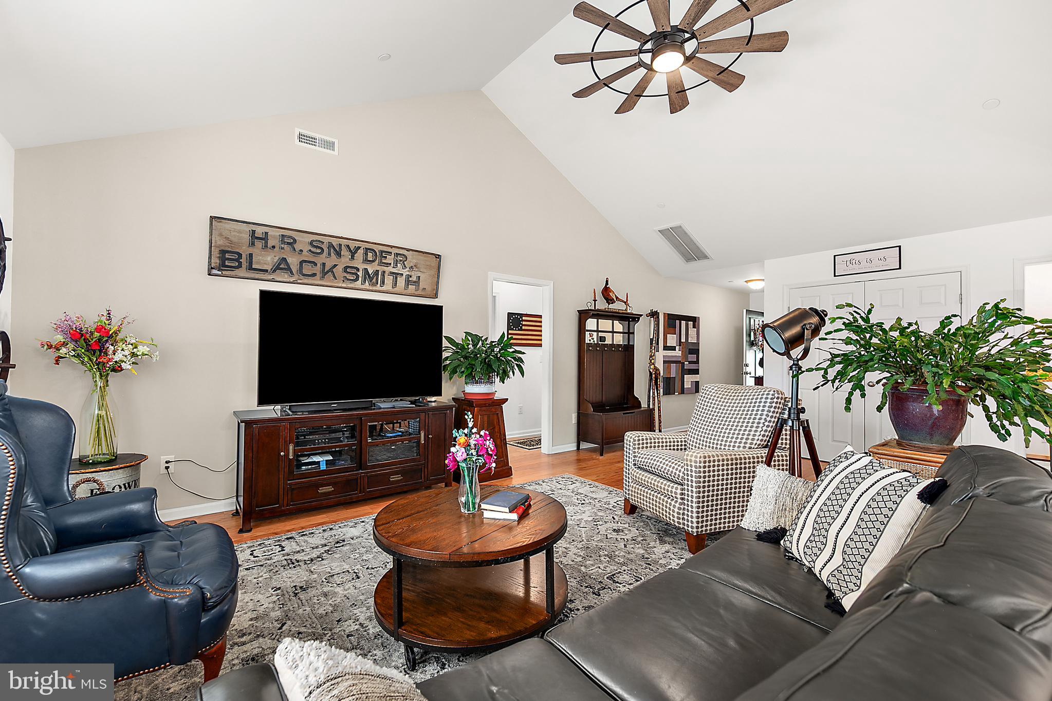 6098 Tarry Town Road Salisbury, MD 21801 - Photo 15 of 60 a living room with furniture and a flat screen tv