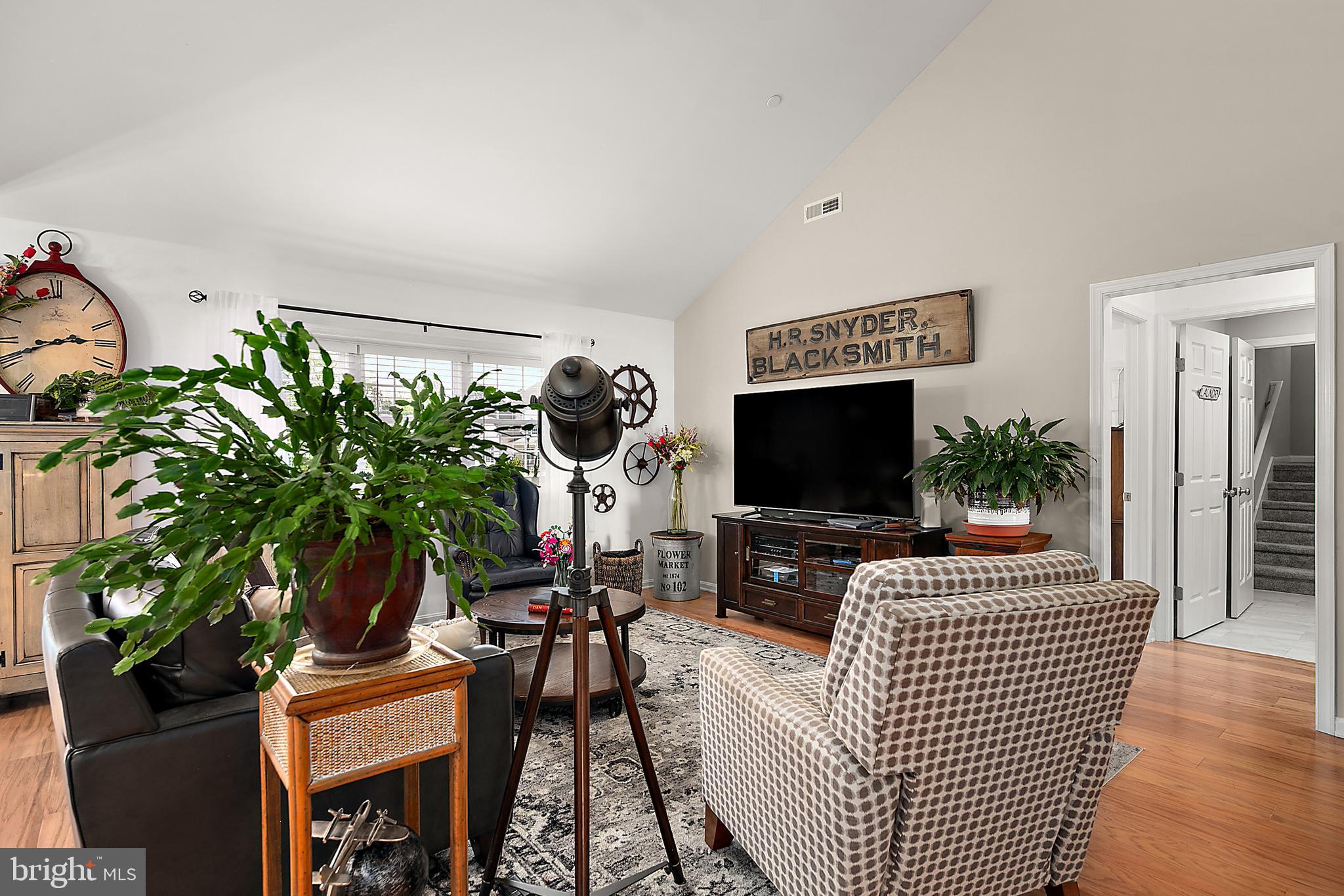 6098 Tarry Town Road Salisbury, MD 21801 - Photo 16 of 60 a living room with furniture and a flat screen tv