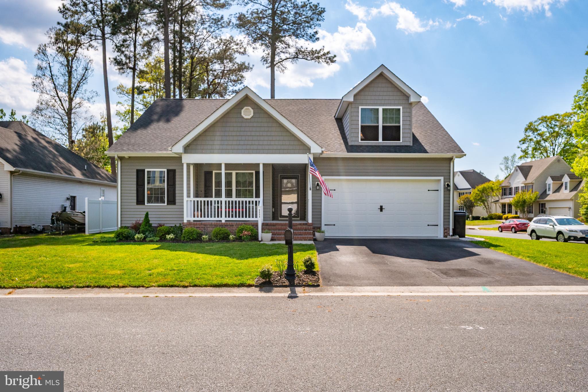 6098 Tarry Town Road Salisbury, MD 21801 - Photo 2 of 60 a view of a house with a yard and garage