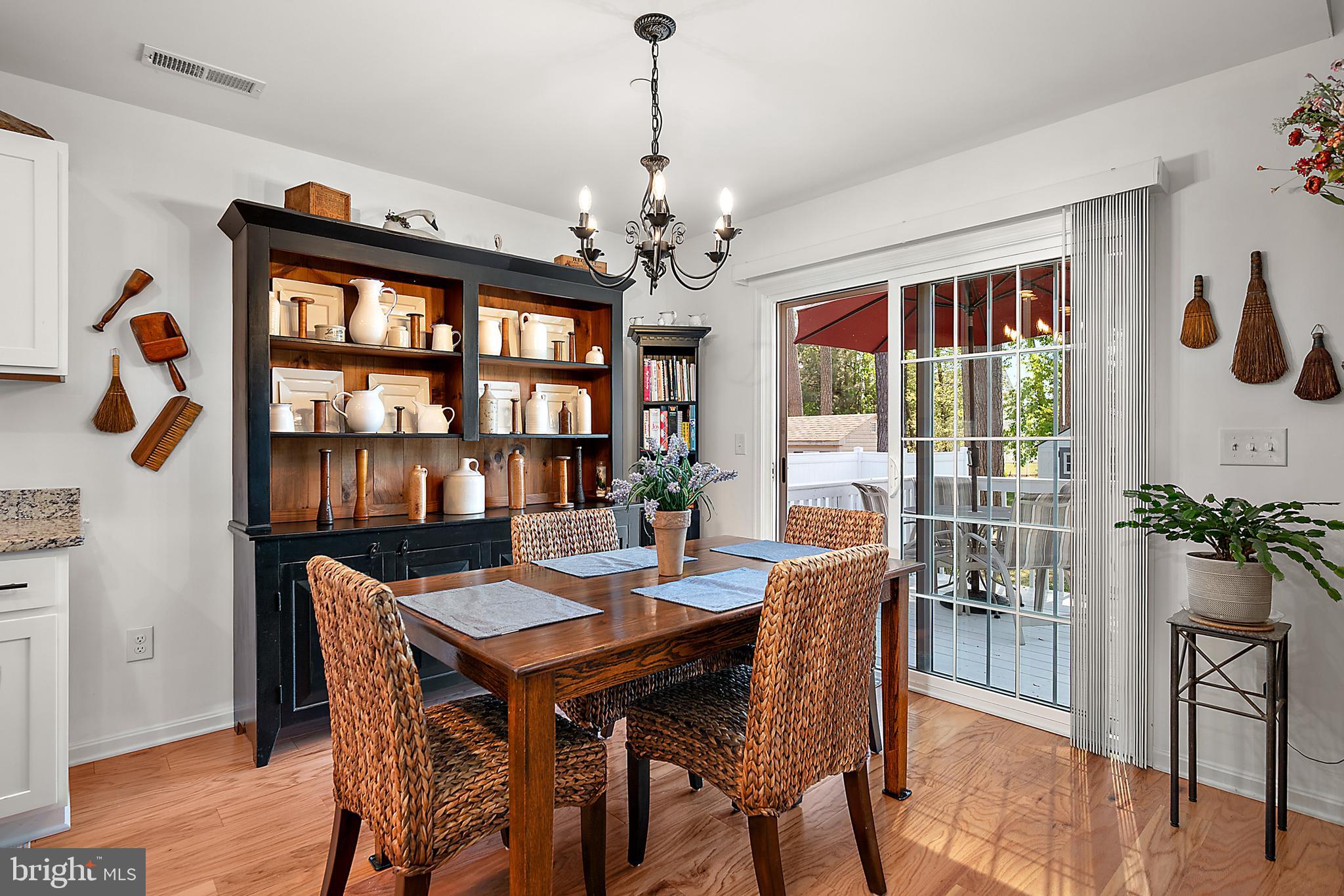 6098 Tarry Town Road Salisbury, MD 21801 - Photo 25 of 60 a view of a dining room with furniture wooden floor and chandelier